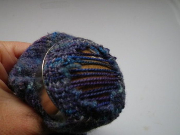 Using a darning mushroom to weave in ends